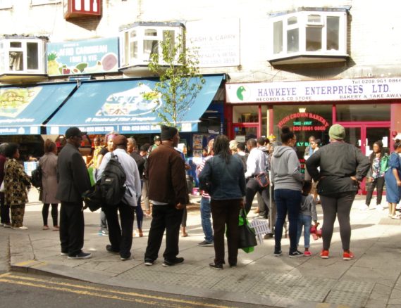 Crowds gathering by Reggae Tree